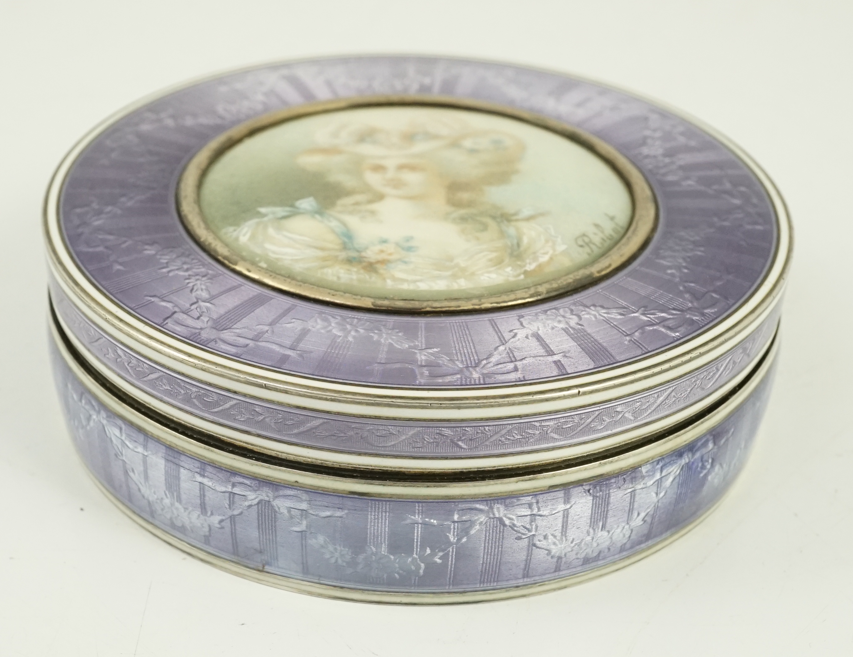 A 19th century French part engine turned silver and guilloche enamelled circular box and cover